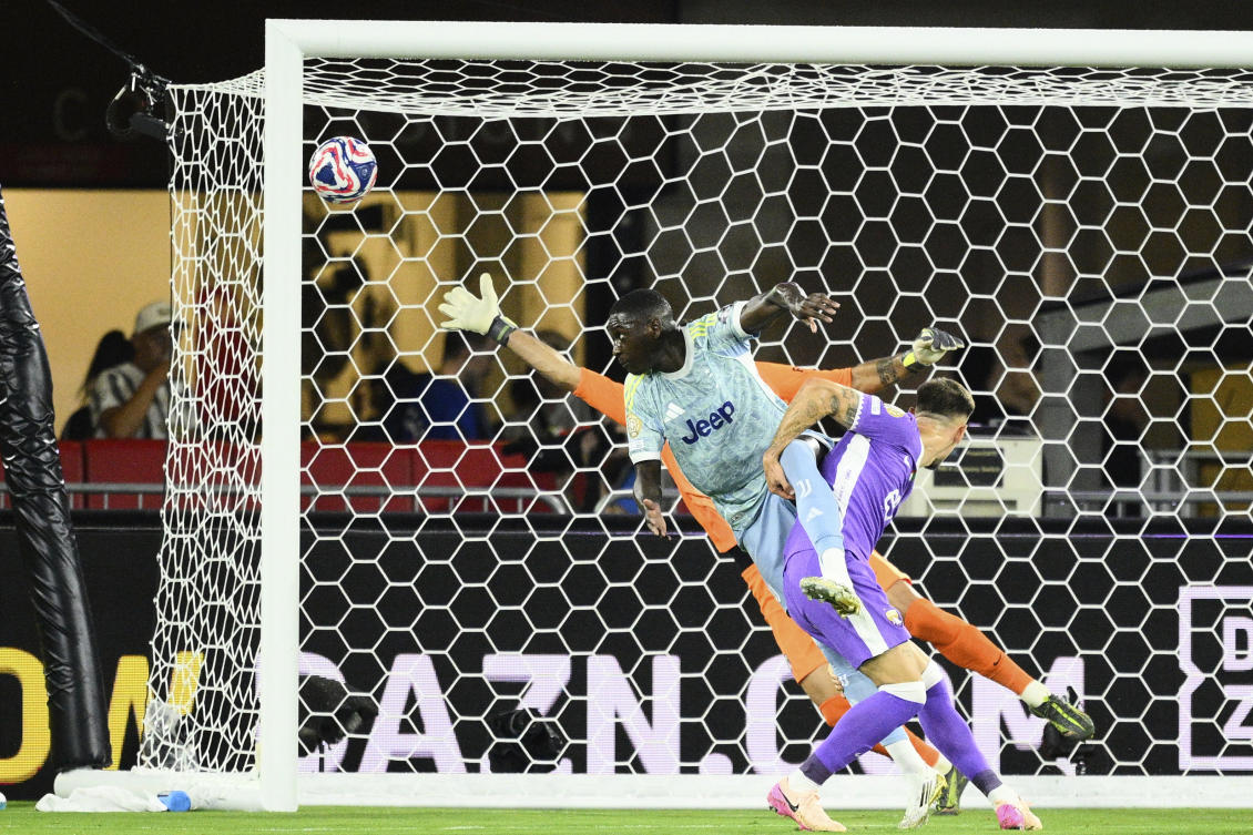 Juventus’ Randal Kolo Muani, top, heads the ball to score his team’s first goal during the Club World Cup group G match between Al-Ain and Juventus in Washington on June 18, 2025. (AP)