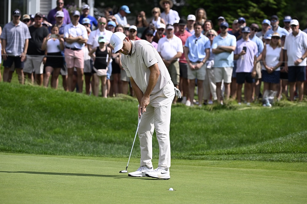 Scottie Scheffler sinks a birdie on the ninth hole during the first round of the Travelers Championship golf tournament at TPC River Highlands Thursday in Cromwell, Conn. (AP)
