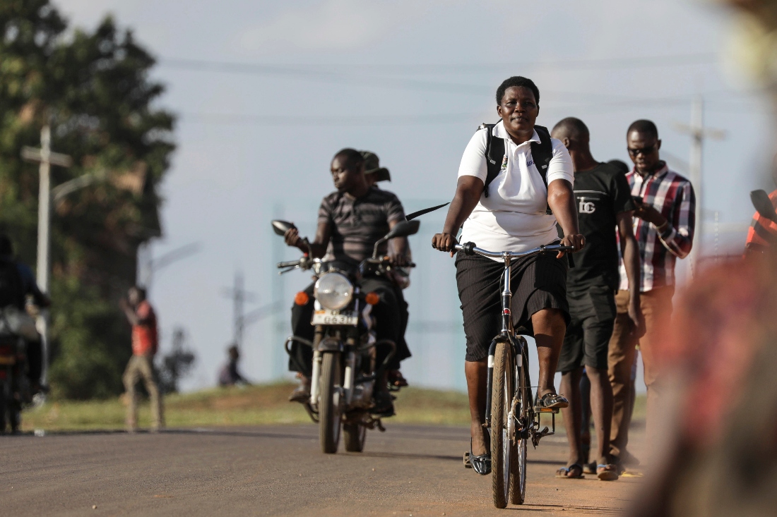 Lucy Abalo, Community Health Extension Worker rides her Buffalo bicycle in Lira, Uganda. (AP)