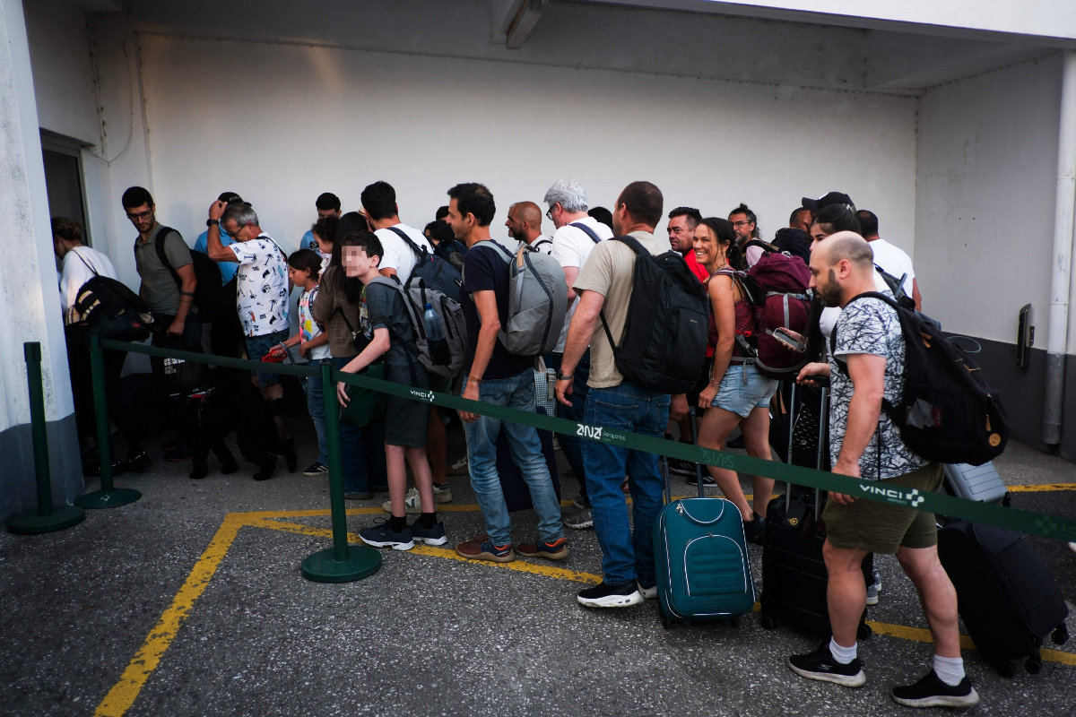 Citizens repatriated from Israel disembark a flight from Egypt at Figo Maduro airport in Lisbon on June 19, 2025. (AFP)