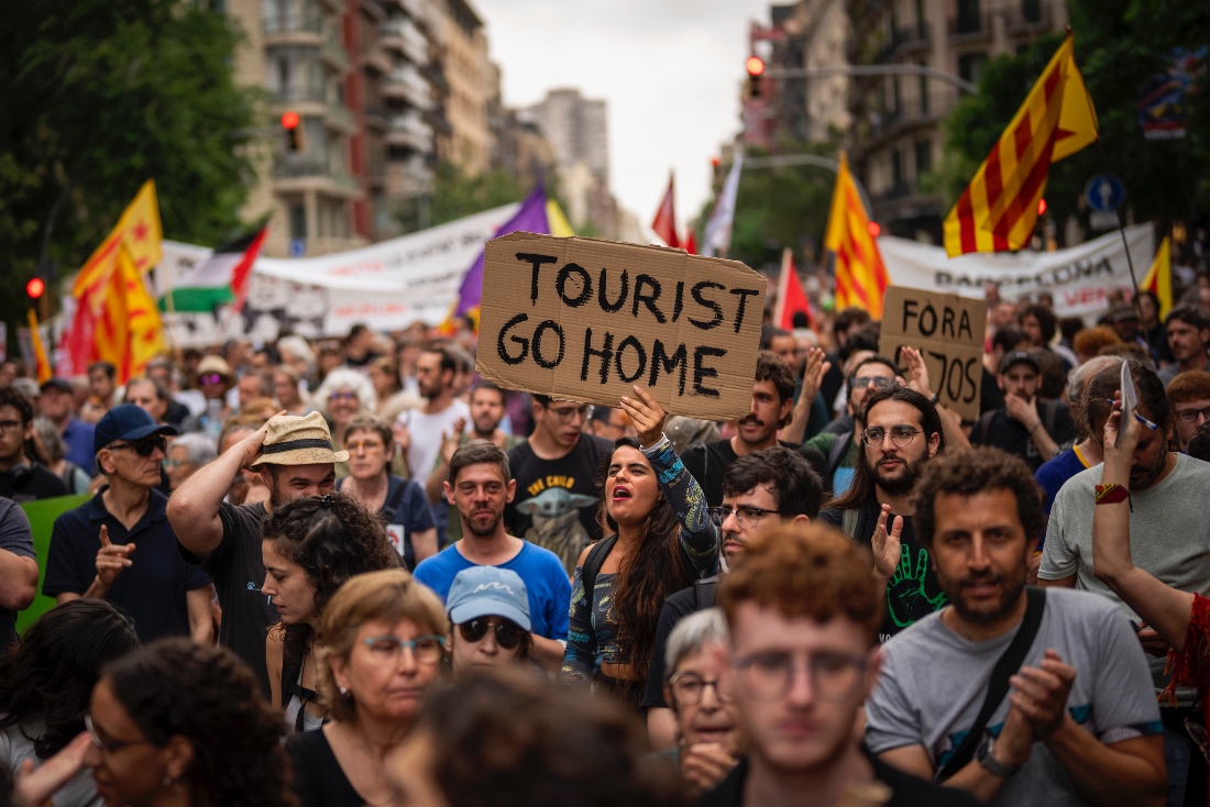 Protestors march against the Formula 1 Barcelona Fan Festival in downtown Barcelona, Spain. (AP)