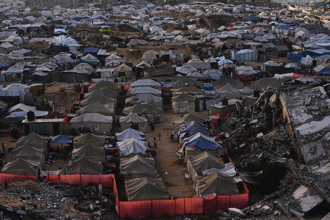 Camp for displaced Palestinians among the ruins of buildings in west of Gaza City. (AP)