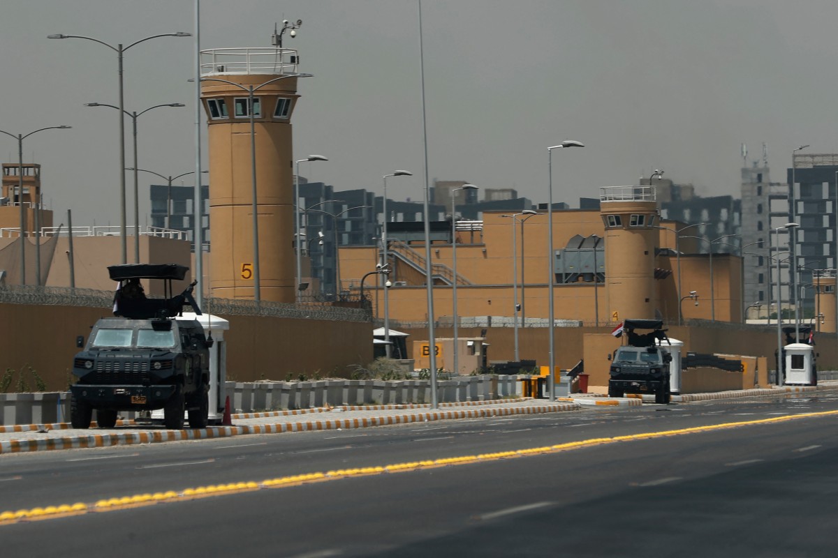 Armoured vehicles of the Iraqi Counter Terrorism Forces are deployed outside the US embassy building in Baghdad's Green Zone, June 12, 2025. (AFP)
