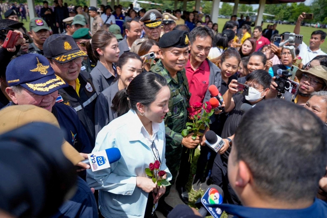 Thailand's Prime Minister Paetongtarn Shinawatra eceives flowers as she arrives in Ubon Ratchathani, Thailand. (HANDOUT/Reuters)