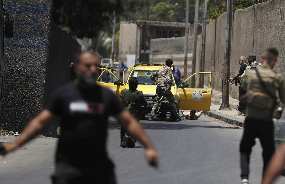 Syrian government security forces check a car near Mar Elias church where a suicide bomber detonated himself on Sunday in Dweil’a in the outskirts of Damascus, Syria, Monday, June 23, 2025. (AP)