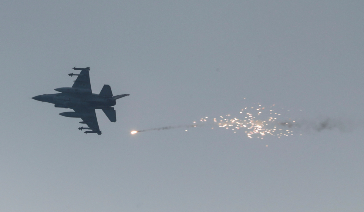 An Israeli aircraft fires a flare, in Gaza City, June 22, 2025. (REUTERS)