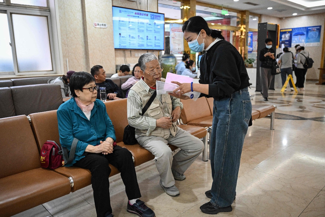Patients picking up prescribed medications at a traditional Chinese medicine hospital in Beijing, China. (AFP)