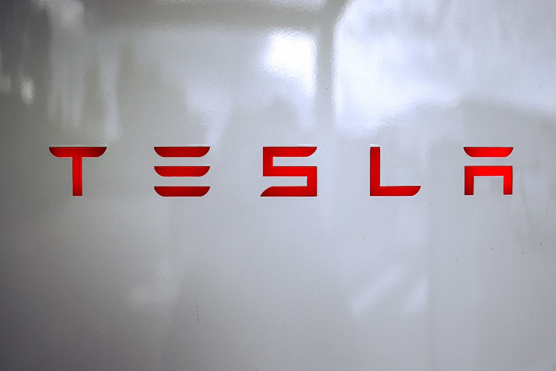 A photo shows the Tesla logo on a charging station in Chasse-sur-Rhone, central France. (AFP)