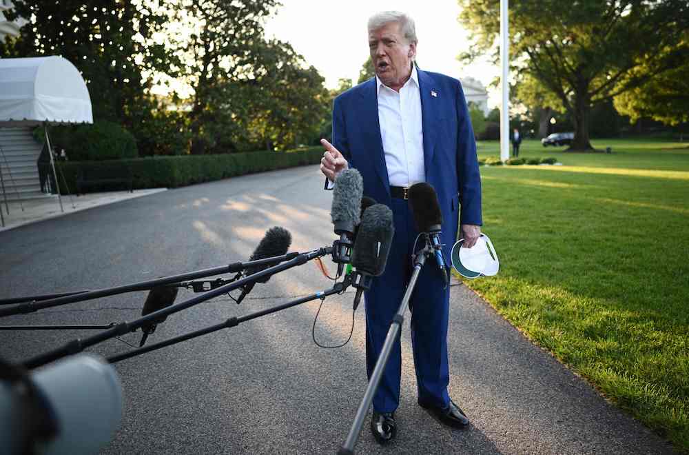 US President Donald Trump speaks to the press before boarding Marine One from the South Lawn of the White House in Washington, DC on June 24, 2025, to attend the NATO's Heads of State and Government summit in The Hague. (AFP)