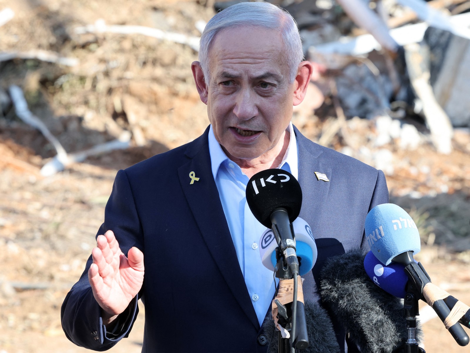 Israel's Prime Minister Benjamin Netanyahu gives a statement during a visit to the site of the Weizmann Institute of Science, which was hit by an Iranian missile barrage, in the central city of Rehovot, June 20, 2025. (AFP)