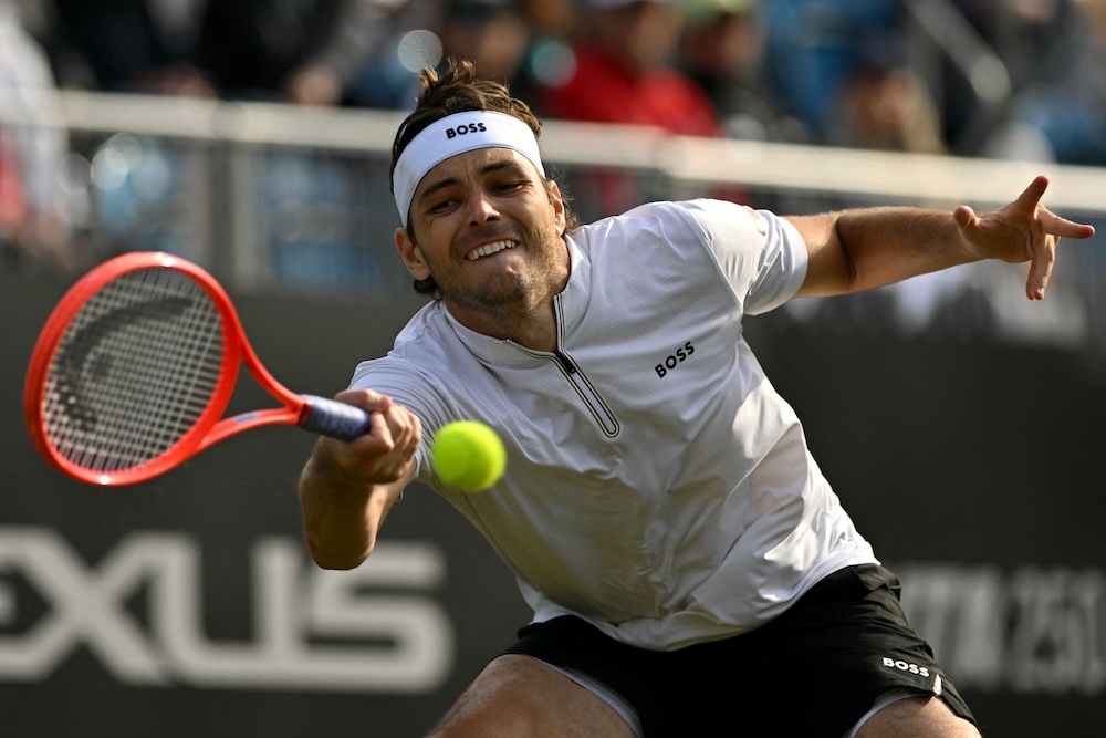 US player Taylor Fritz returns against fellow countryman Marcos Giron during their men’s singles quarterfinal at the Rothesay Eastbourne International tennis tournament in Eastbourne, southern England, Thursday. (AFP)