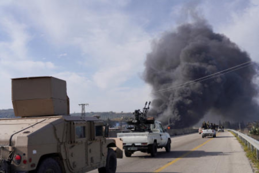 Members from the Syrian forces ride on a vehicle as they battle against an insurgency by fighters from ousted leader Bashar al Assad's Alawite sect, in Latakia, Syria. (Reuters)