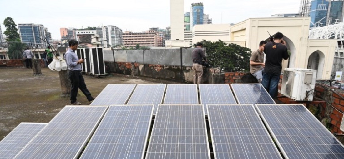 Solar energy panels are seen on the rooftops of a high rise building in Dhaka Capital City in Bangladesh. (AFP)