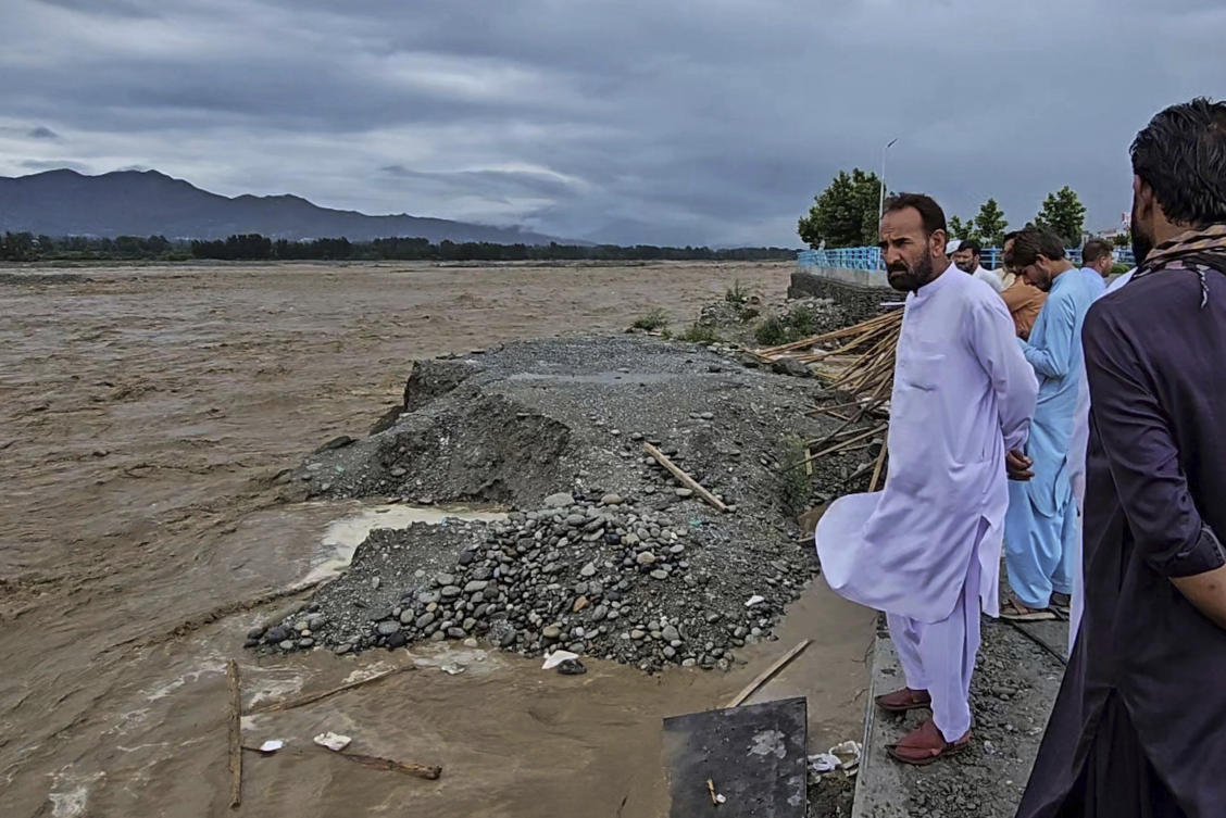 Local residents look to the Swat River, which is overflowing due to pre-monsoon heavy rains in the area, on the outskirts of Mingora, the main town of Pakistan’s Swat Valley on June 27, 2025. (AP)