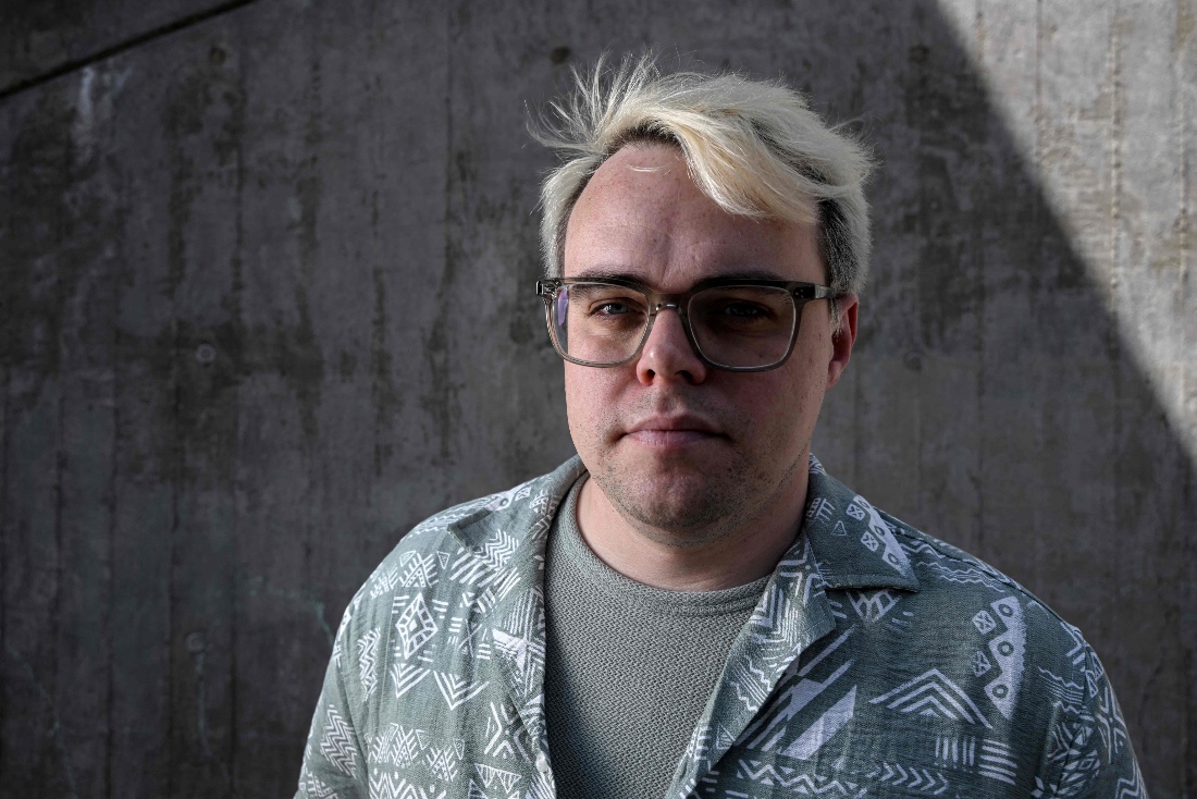 Pavel Talankin, a teacher, videographer and filmmaker from Russia poses during a photo session in Prague. (AFP)