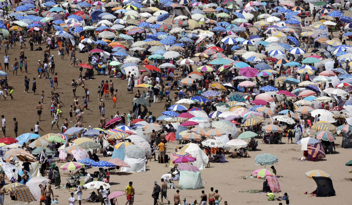 People cool off at a beach during a heatwave in Rabat on June 29, 2025. (AFP)