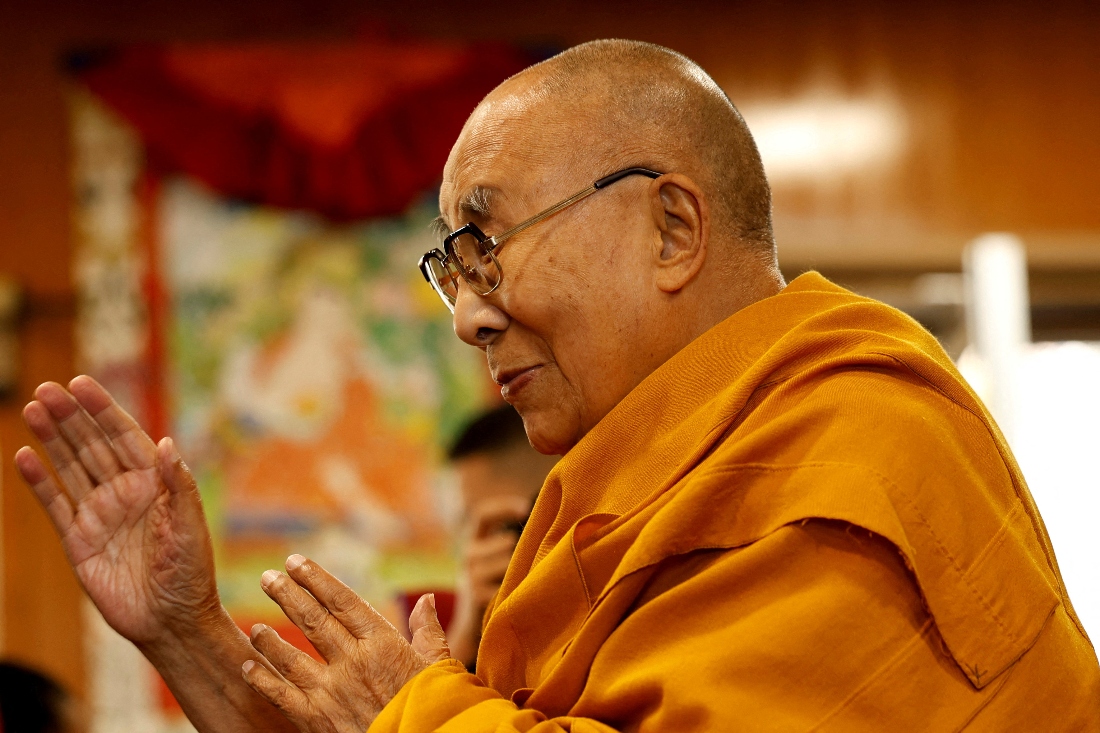 Tibetan spiritual leader, the Dalai Lama, offers blessings to his followers at his Himalayan residence in the hill town of Dharamshala, India. (Reuters(