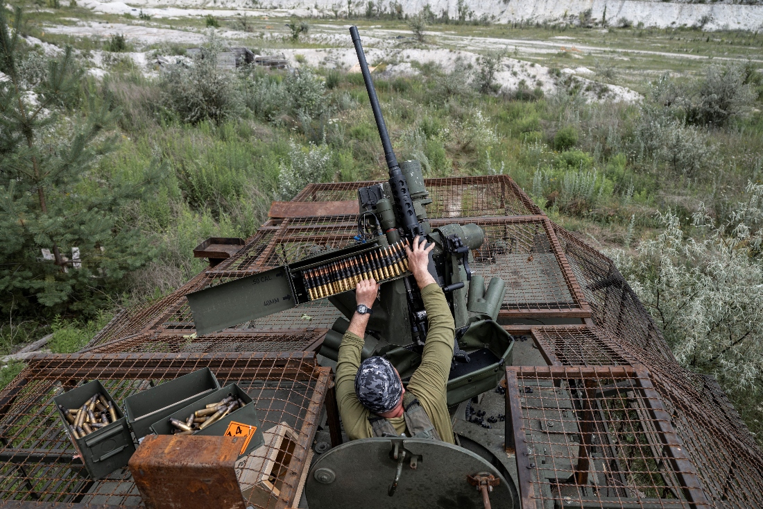 A soldier from the 81st Separate Slobozhanska Airmobile Brigade of the Ukrainian Armed Forces loads ammunition during military exercises at a training ground near a front line in Donetsk region, Ukraine. (Reuters)