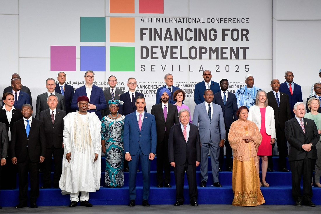 Spanish Prime Minister Pedro Sanchez and UN Secretary General Antonio Guterres pose for a photo with the rest of heads of state and representatives attending the UN's 4th International Conference on Financing and Development in Seville, Spain. (AFP)