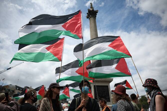 Flags of Palestine fly during a protest in support of pro-Palestinian group Palestine Action, in Trafalgar Square, central London, on June 23, 2025, as British government is expected to announce the group's ban. (AFP)