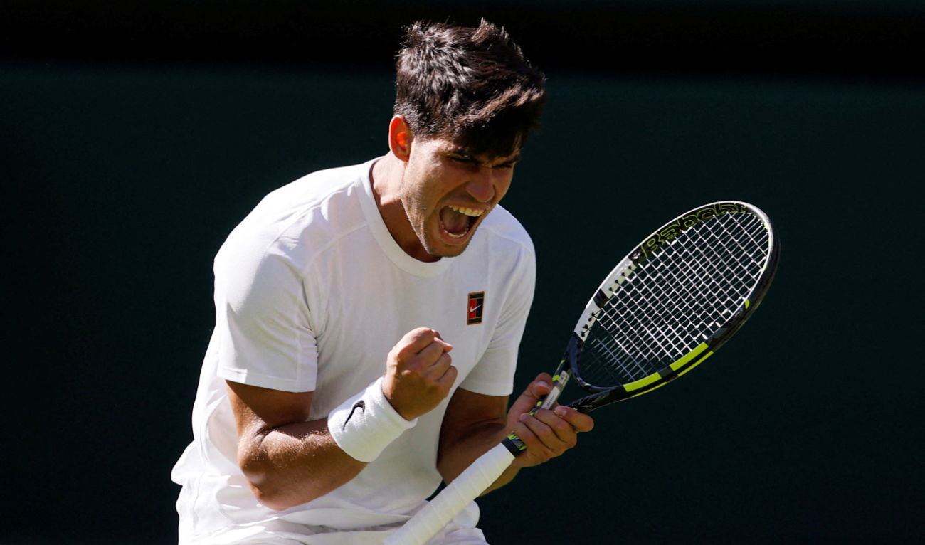 Spain's Carlos Alcaraz reacts during his first round match against Italy's Fabio Fognini. (Reuters)