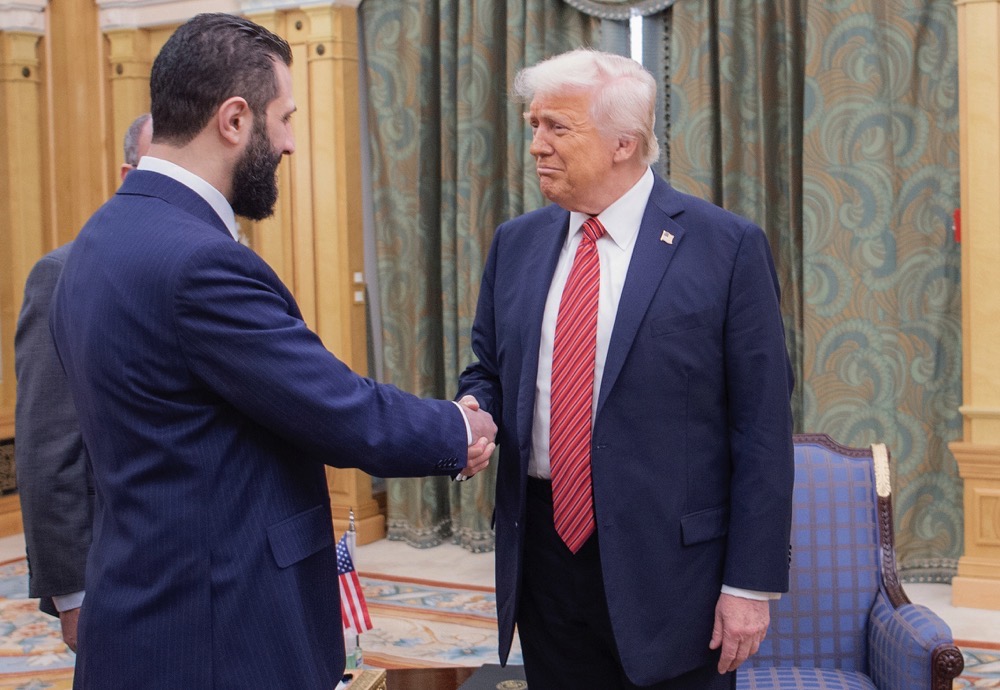 President Donald Trump shakes hands with Syria’s interim President Ahmad Al-Sharaa, in Riyadh, Saudi Arabia, May 14, 2025. (SPA)