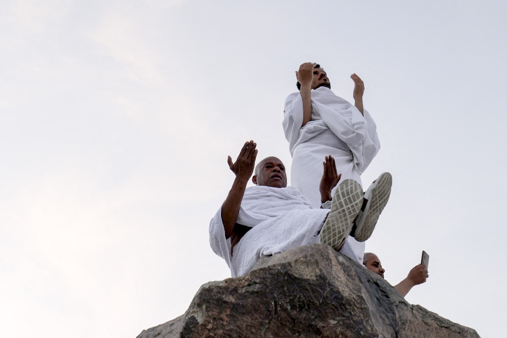 Muslims offer prayers on top of Mount Arafat during the annual Hajj pilgrimage on June 5, 2025. (AFP)