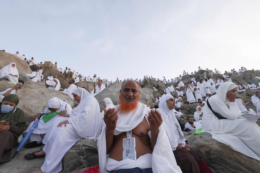 Muslims offer prayers on top of Mount Arafat during the annual Hajj pilgrimage on June 5, 2025. (AFP)