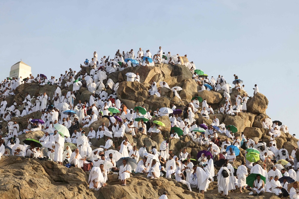 Muslims offer prayers on top of Mount Arafat during the annual Hajj pilgrimage on June 5, 2025. (AFP)