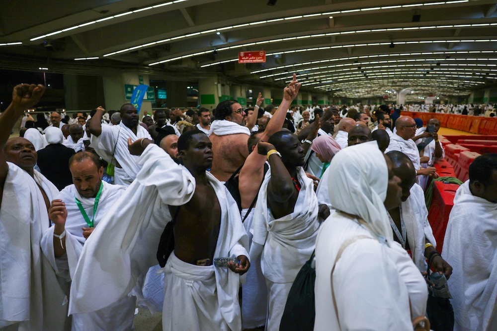Muslim pilgrims perform the symbolic ‘stoning of the devil’ ritual as part of the hajj pilgrimage in Mina on June 6, 2025. (AFP)