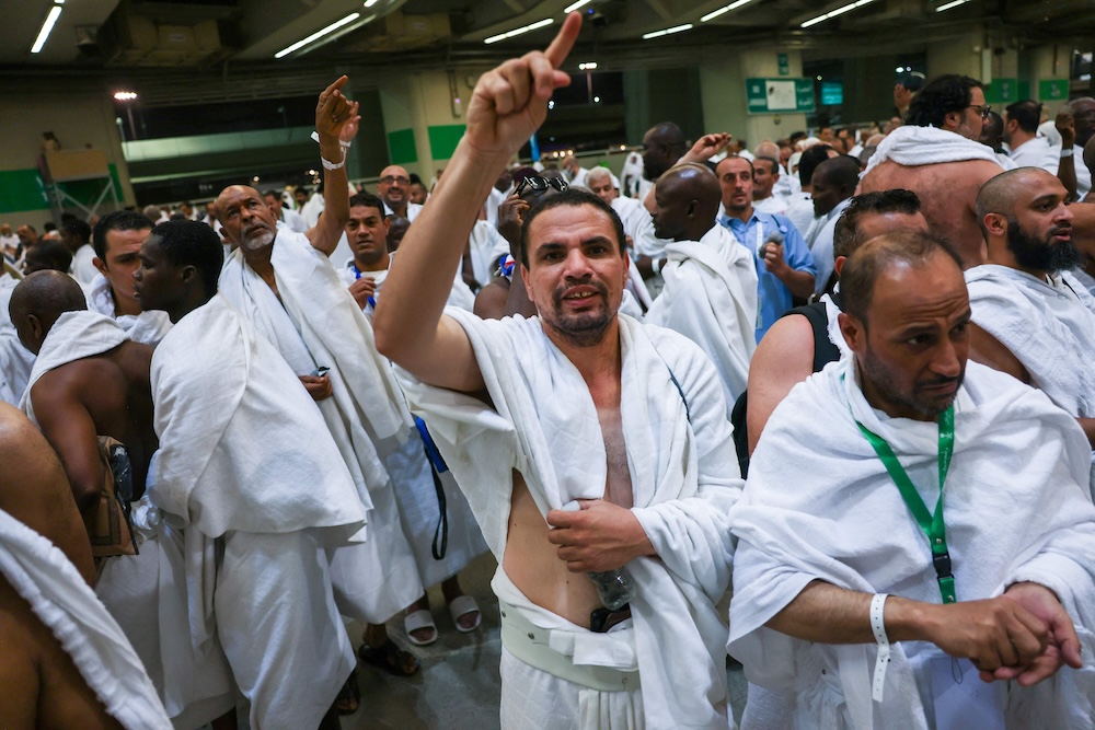 Muslim pilgrims perform the symbolic ‘stoning of the devil’ ritual as part of the hajj pilgrimage in Mina on June 6, 2025. (AFP)