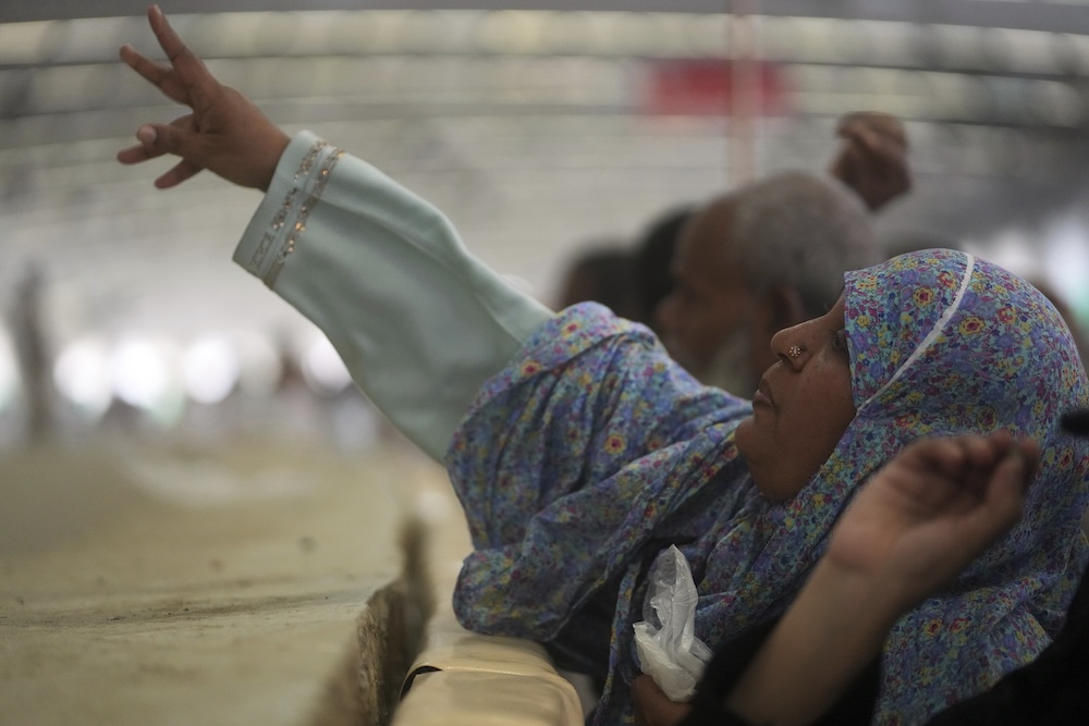 Muslim pilgrims cast stones at pillars in the symbolic stoning of the devil on June 6, 2025. (AP)