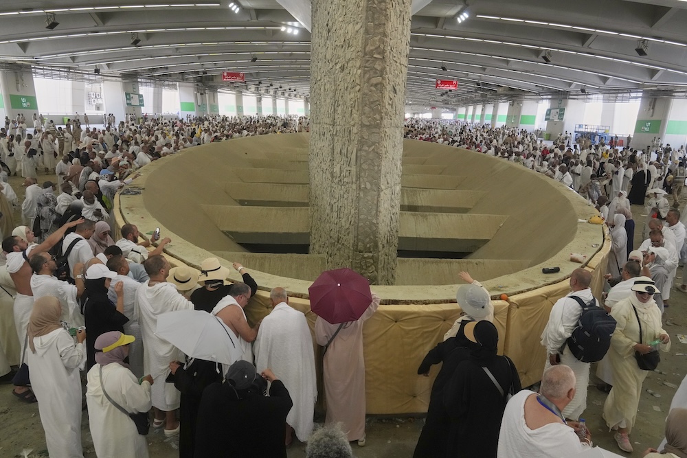 Muslim pilgrims cast stones at pillars in the symbolic stoning of the devil on June 6, 2025. (AP)