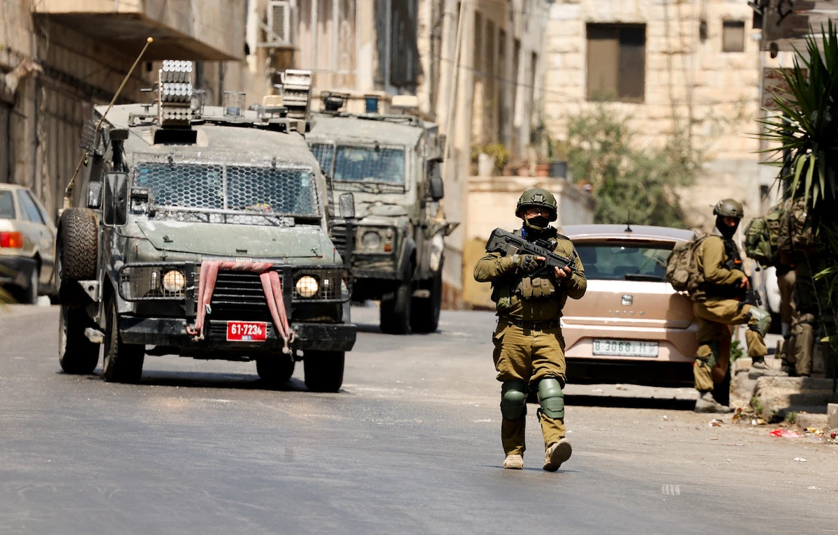 Israeli soldiers take part in an Israeli raid in Nablus, the Israeli-occupied West Bank, June 10, 2025. (Reuters)
