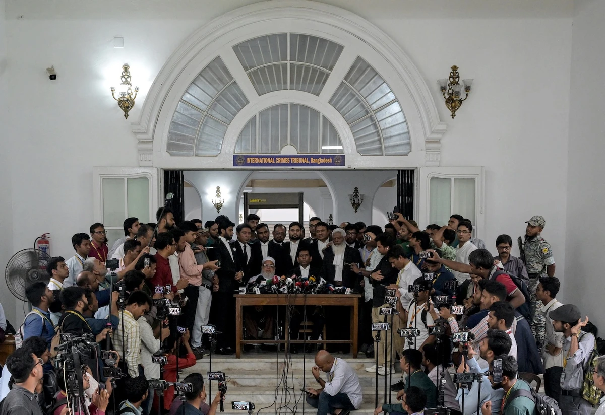 Chief prosecutor of Bangladesh's International Crimes Tribunal Mohammad Tajul Islam (C) speaks during a press conference outside the ICT court in Dhaka on June 1, 2025, after the start of the trial against former prime minister Sheikh Hasina. (AFP)