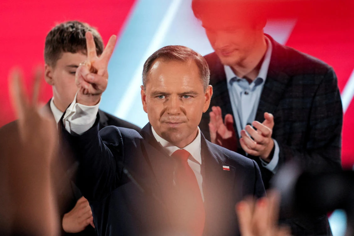 Polish presidential candidate Karol Nawrocki, backed by the main opposition Law and Justice (PiS) party, reacts to the exit polls of the second round of the presidential election, in Warsaw, Poland, June 1, 2025. (Reuters)
