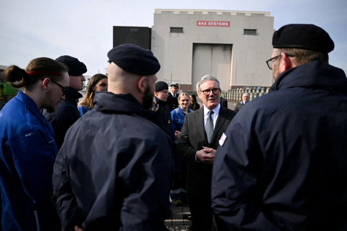 Britain's Prime Minister Keir Starmer speaks to Royal Navy Submariners of the HMS Agamemnon nuclear submarine and to BAE system apprentices outside of the BAE system factory, in Barrow-in-Furness, Britain, March 20, 2025. (Reuters)
