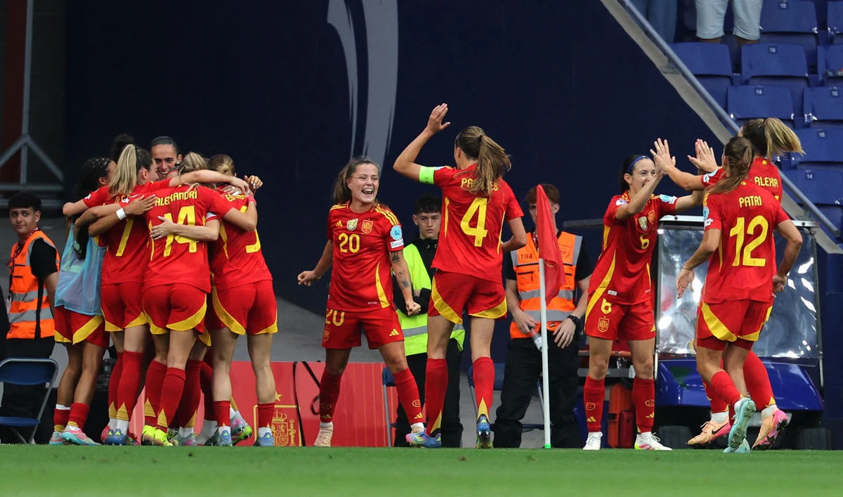 Spain's forward #20 Claudia Pina (C) celebrates with teammates scoring her team's second goal during the UEFA Women's Nations League Group A3 match between Spain and England at the RCDE Stadium in Cornella de Llobregat, outside Barcelona, on Tuesday. (AFP)