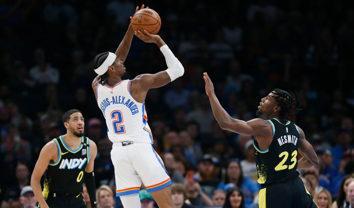 Oklahoma City Thunder guard Shai Gilgeous-Alexander (2) looks to shoot between Indiana Pacers guard Tyrese Haliburton (0) and forward Aaron Nesmith (23) during an NBA basketball game on March 12, 2024, in Oklahoma City. (File/AP)
