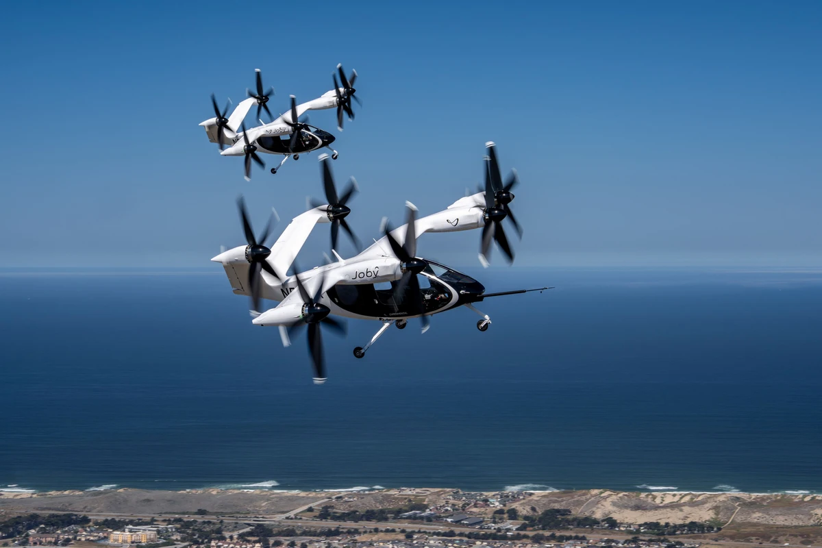 Joby’s piloted, all-electric aircraft is designed to carry four passengers at speeds of up to 200 mph, with a fraction of the noise produced by helicopters.