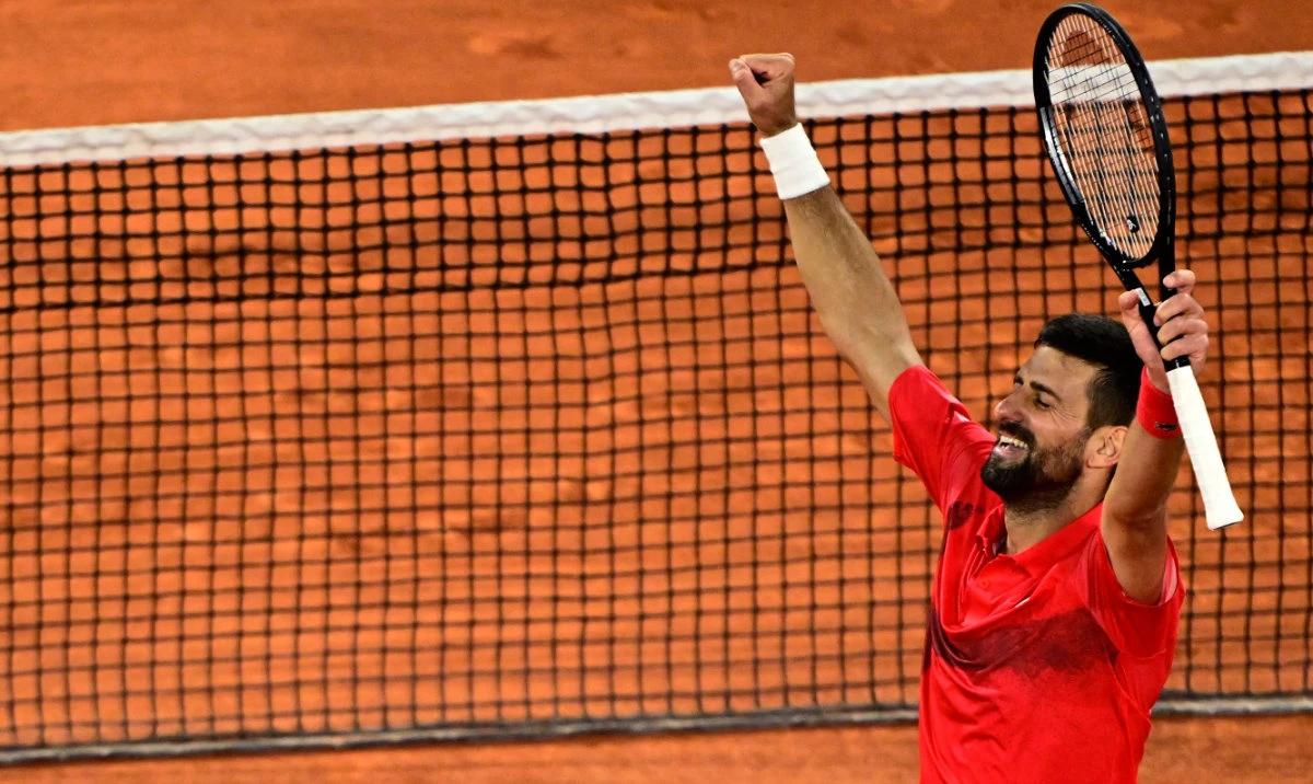 Serbia's Novak Djokovic celebrates after winning against Germany's Alexander Zverev at the end of their men's singles quarter-final match on day 11 of the French Open tennis tournament on Court Philippe-Chatrier at the Roland-Garros Complex in Paris on June 4, 2025. (AFP)