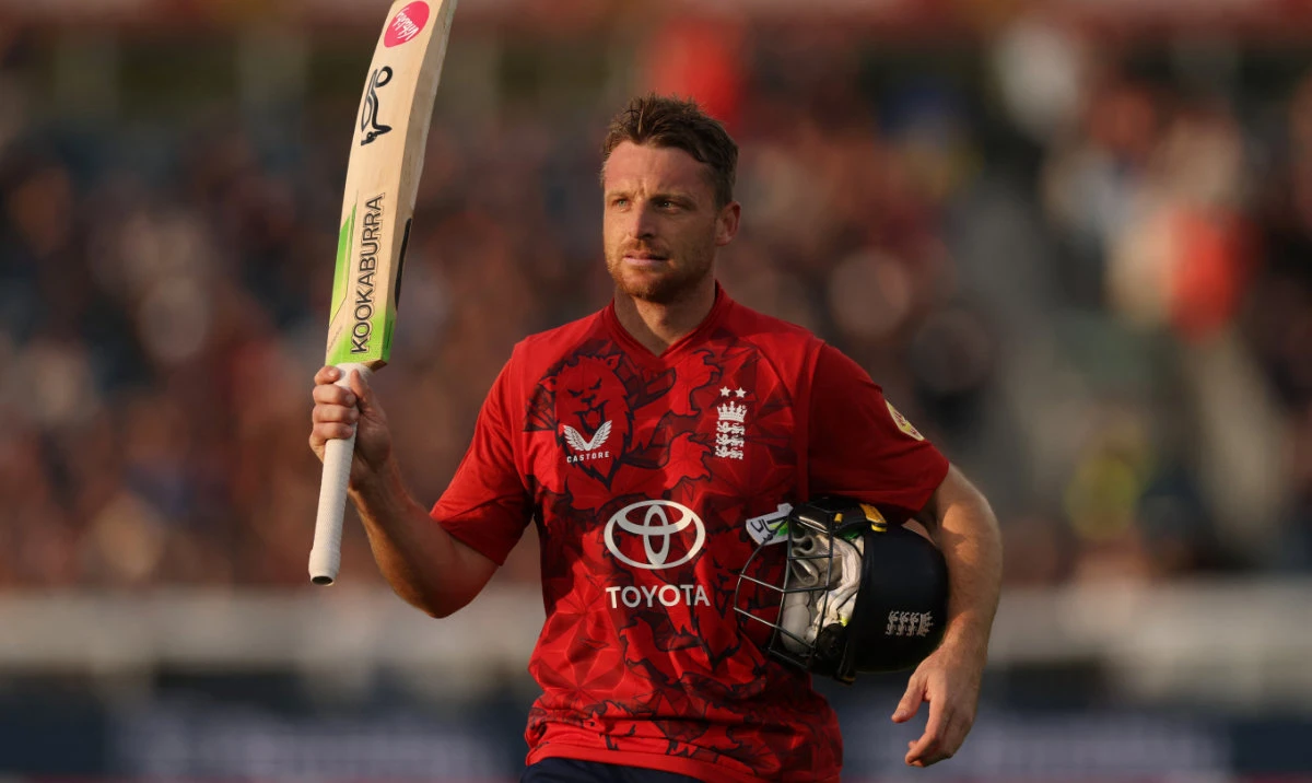 England's Jos Buttler raises his bat as he walks to the pavilion after losing his wicket, LBW bowled by West Indies' Alzarri Joseph. (Reuters)