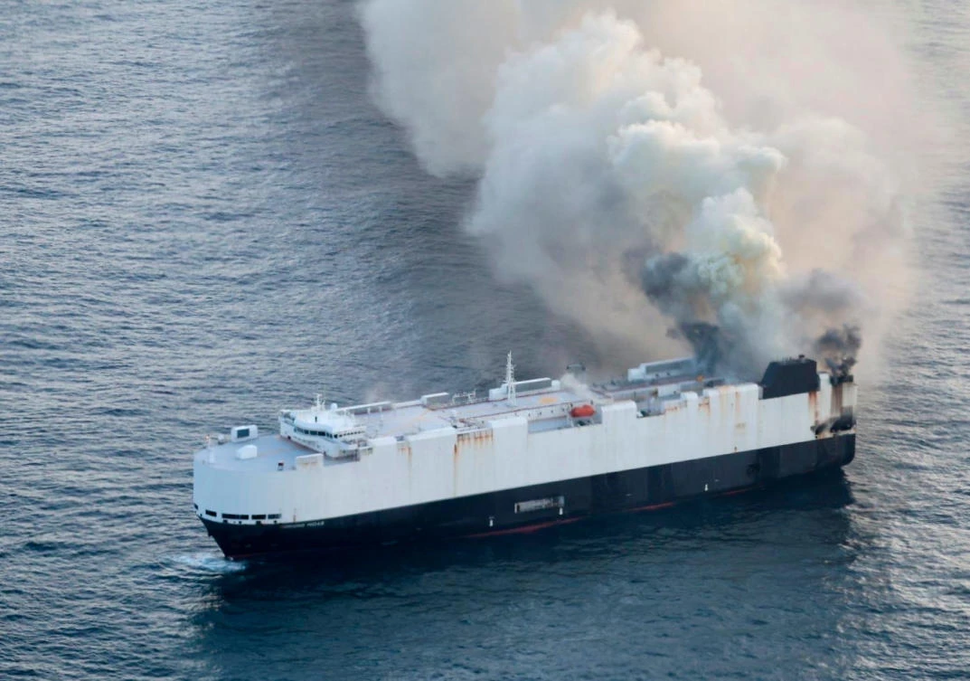 Smoke rises from cargo vessel Morning Midas approximately 300 miles south of Adak, Alaska, June 3, 2025, as the crew abandoned ship after they could not control a fire in the ship. (US Coast Guard/Courtesy Air Station Kodiak via AP)