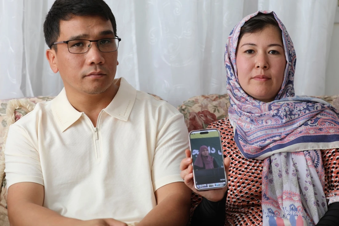 Mohammad Sharafoddin and his wife Nuriya show a photo of their niece in Afghanistan. The (AP)