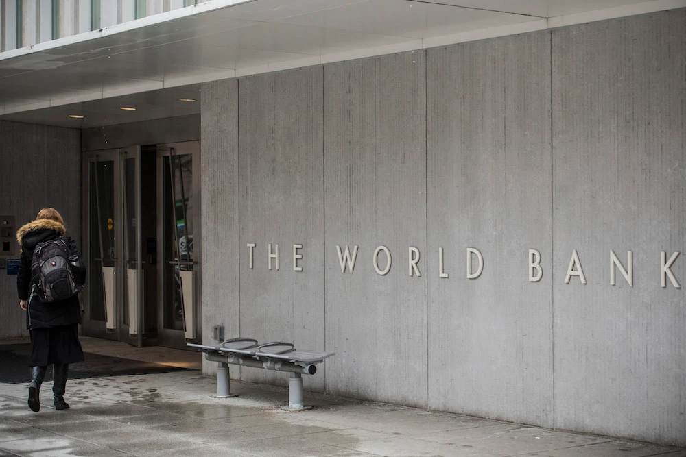 A person enters the building of the Washington-based global development lender, The World Bank Group, in Washington. File/AFP