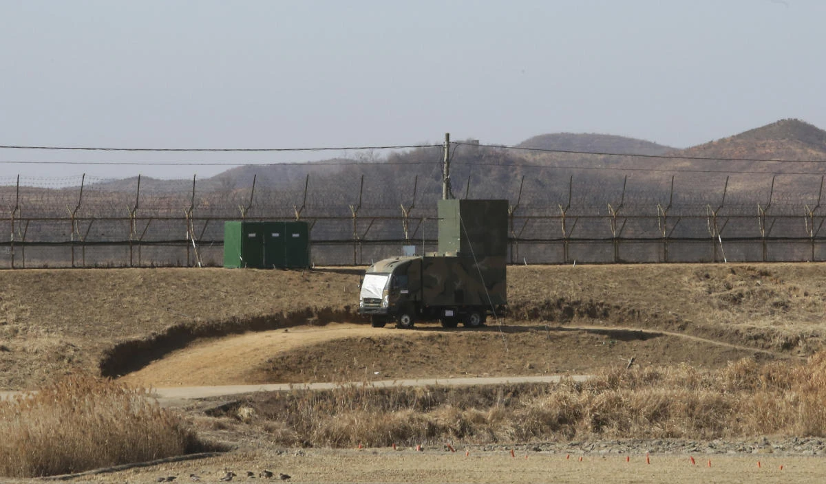 Above, a South Korean military vehicle with loudspeakers is seen in front of the barbed-wire fence in Paju, near the border with North Korea, on Feb. 15, 2018. (AP file photo)