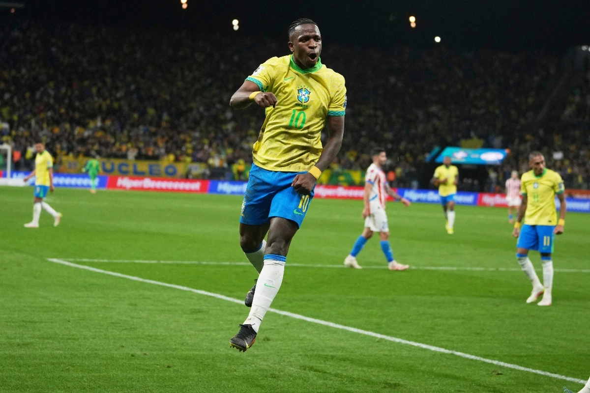Brazil's Vinicius Junior celebrates scoring his side's opening goal against Paraguay during a World Cup 2026 qualifying soccer match at Neo Quimica Arena in Sao Paulo, Tuesday. (AP)