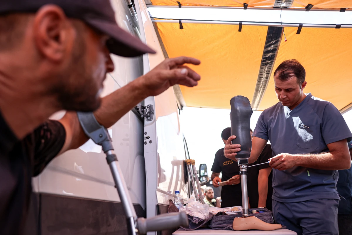 An amputee looks on as a new prosthetic limb is prepared at the Jordanian field hospital in Khan Yunis in the southern Gaza Strip. (File/AFP)