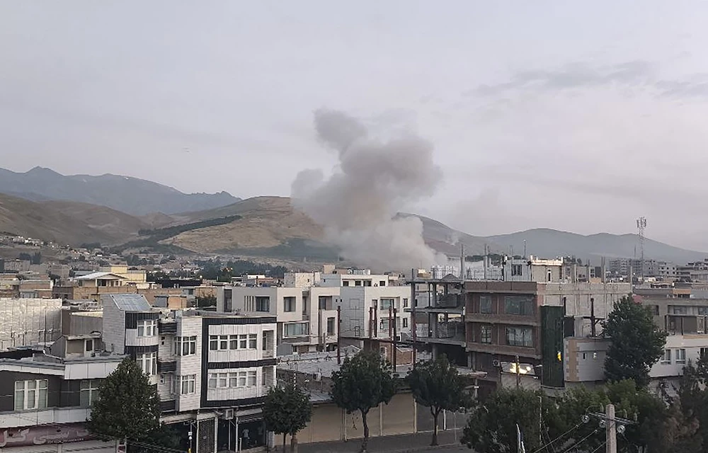Smoke billows from a site targeted by an Israeli strike in the Iranian capital Tehran early in the morning of June 13, 2025. (Sepah News/AFP)