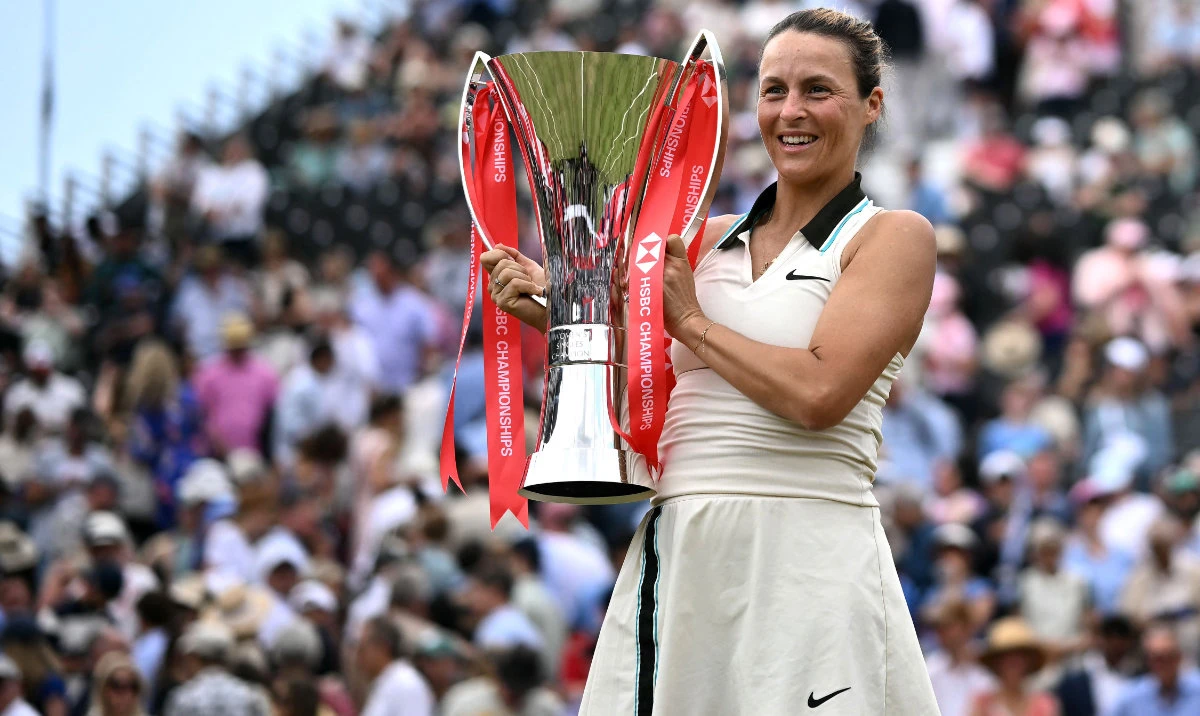 German player Tatjana Maria poses with the trophy after winning against US player Amanda Anisimova during their women's singles final tennis match on the last day of the HSBC WTA tennis Championships at Queen's Club in west London on June 15, 2025. (AFP)